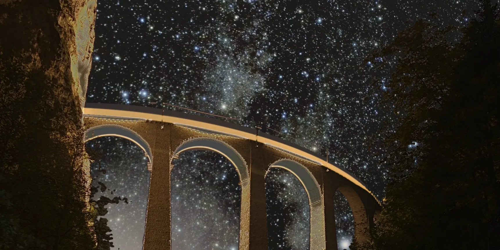 A curving stone railway viaduct at night, its arches open to a sky dense with stars and the Milky Way, with a train's light trail running along the deck.