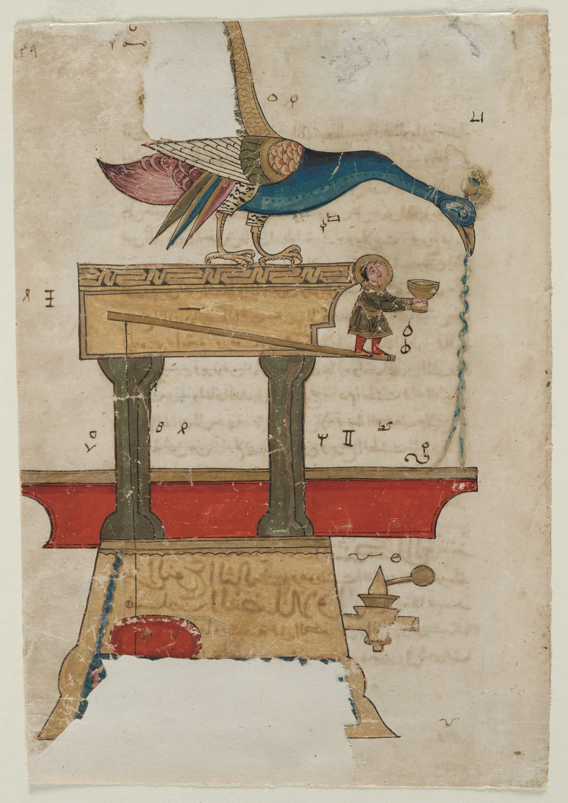 A manuscript page with faint Arabic writing behind and beside a painted device. A peacock bends forward on top of a box raised on two pillars, with water pouring from its beak, and a small standing figure appears in a doorway in the side of the box. A red-rimmed basin sits below the pillars. The colours are gold, red, blue and green on cream paper.